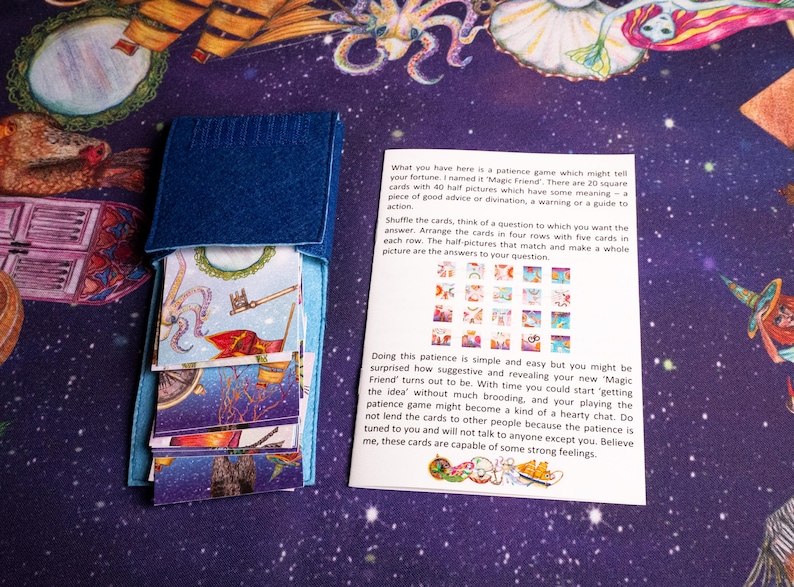 Magic Friend textile pouch and printed instruction sheet on the reading cloth.