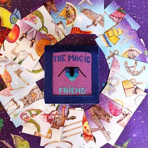 Magic Friend fortune-telling patience cards arranged in a circle with the handmade pouch in the center.