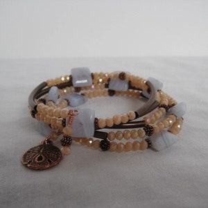 Handmade memory wire bracelet with peach Moonstones, blue agate, and copper findings