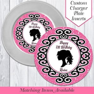 May include: Two pink and black glitter charger plate inserts with a black silhouette of a girl with long hair and the text "Happy 6th Birthday Reina".
