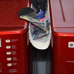 The Sock Catcher: catches your laundry before it falls between or behind your washer and dryer.