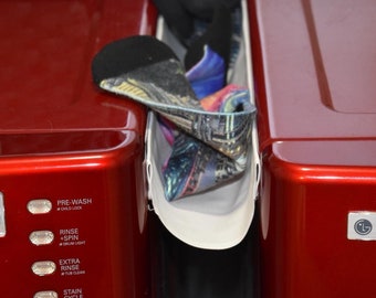 The Sock Catcher: catches your laundry before it falls between or behind your washer and dryer.