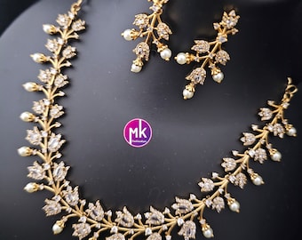 Beautiful design Gold finish AD stone necklace with matching Earrings - Trendy Necklace - MK Fashionkart