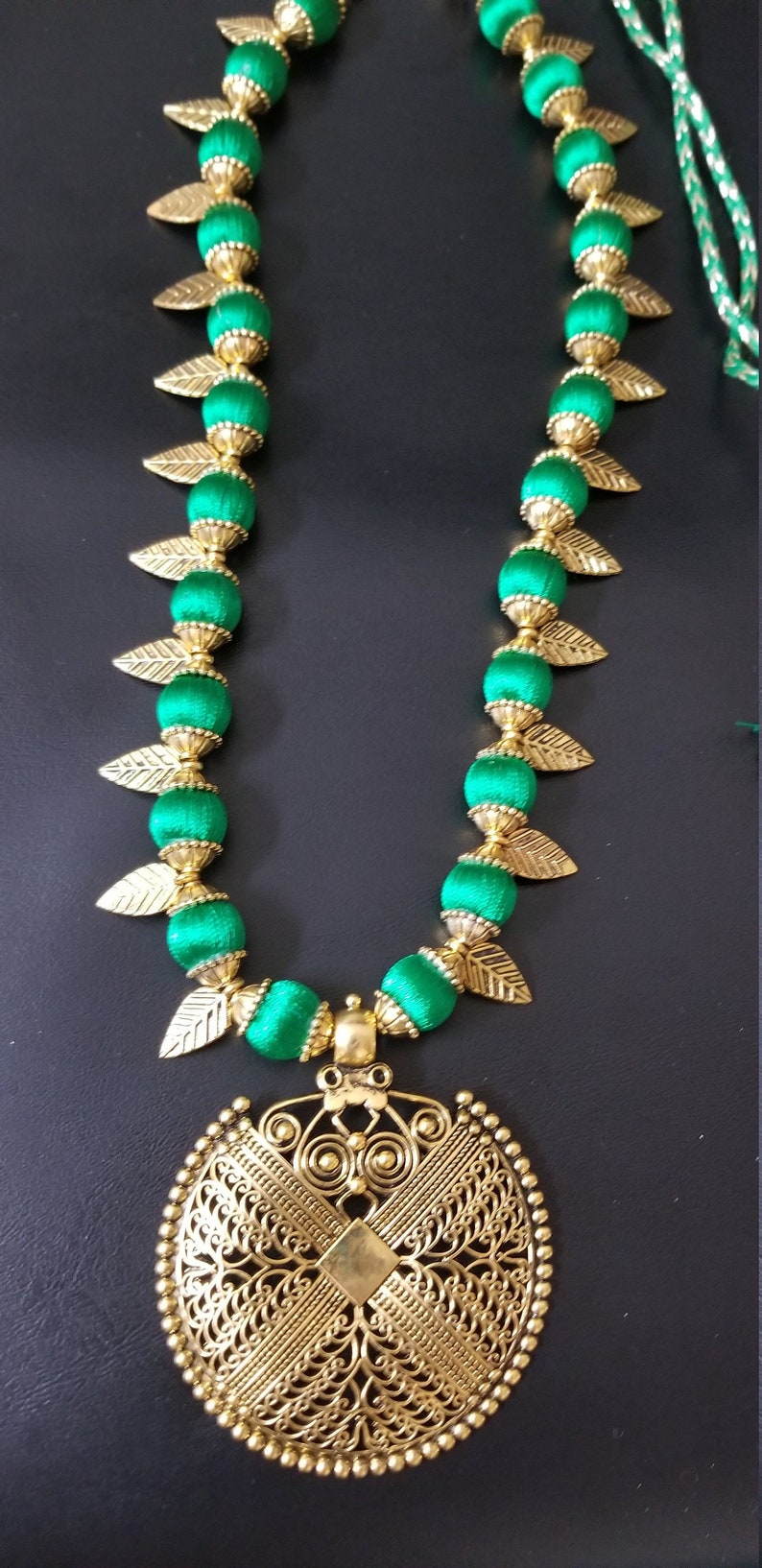 Indian Fashion Jewelry MK Fashionkart Antique finish pendent with green silk thread beads and Antique leaves