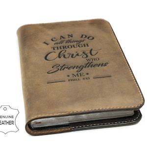 May include: A brown leather-bound journal with the inscription "I can do all things through Christ who strengthens me.  Phil 4:13" on the front cover.