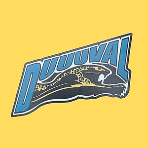 May include: A graphic design featuring the word "DUUUVAL" in blue and white, with a stylized jaguar leaping through the letters. The design is set against a solid yellow background.