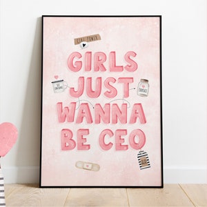 May include: Pink and white framed print with the text "Girls Just Wanna Be CEO" in pink letters. The print has various small pink and white illustrations around the text.