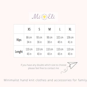 May include: Size chart for knit clothing with measurements in inches and centimeters. The chart shows sizes XS, S, M, L, and XL with measurements for hips and length.