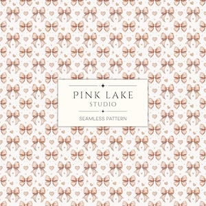 May include: A seamless pattern featuring watercolour illustrations of delicate pink bows and small hearts on a white background. The text "PINK LAKE STUDIO" and "SEAMLESS PATTERN" is displayed in a black banner.