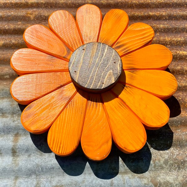 Bright orange wooden flower wall decoration handmade from reclaimed materials