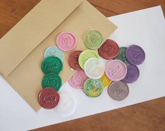 May include: Assortment of colorful wax seals with various designs and lettering, including "Thank You", "You're Invited", and "Forever Yours".
