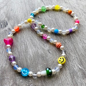 Mixed beaded necklace. Mushroom, smiley, flower heart beads. Rainbow. Opalite beads and glass pearls.