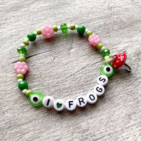 Beaded frog mushroom name bracelet. Glass and acrylic beads with enamel mushroom toadstool charm. Red and Green. Personalised. Handmade.