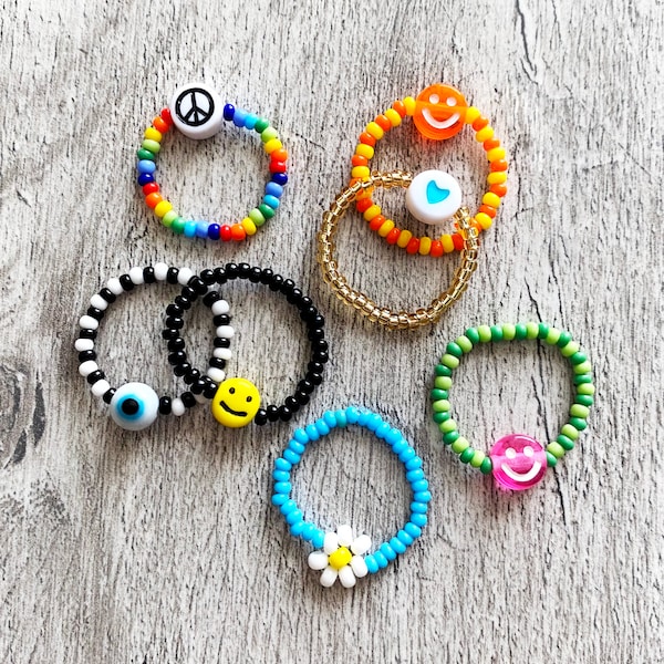 Dainty Beaded rings. Choose your seed bead colours. Smiley, eyeball, heart and daisy flower. Rainbow colours. Gold and Silver.