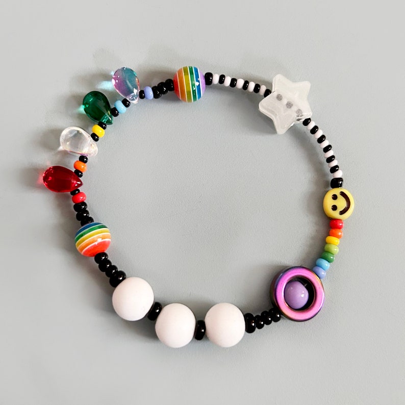 Sensory fidget bracelet. Rainbow, sliding glow in the dark star, hematite smiley spinner, rubber and glass beads. Adult or child size. image 2