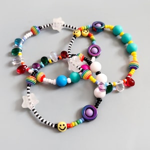 Sensory fidget bracelet. Rainbow, sliding glow in the dark star, hematite smiley spinner, rubber and glass beads. Adult or child size. image 4