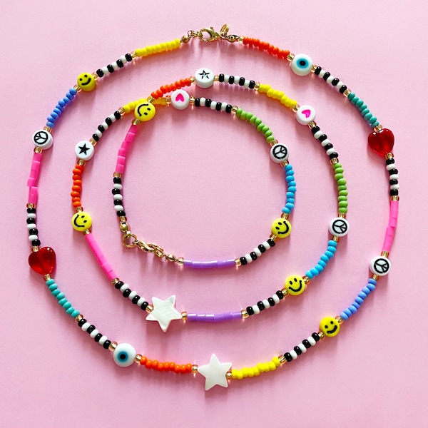 Beaded rainbow necklaces. Smileys, peace signs, evil eyes, stars and hearts. Seed beads.