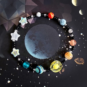 Space Solar System Bracelet. Handmade beaded elasticated bracelet featuring planets and stars.