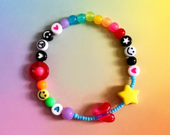 Pulsera sensorial de cuentas para aliviar la ansiedad/TDAH/Autismo. Colores del arcoíris con corazones, estrellas y caritas sonrientes.