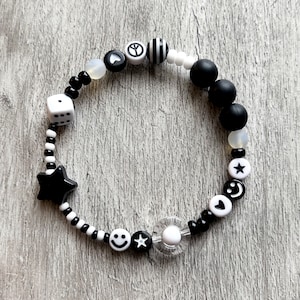 Fidget/sensory bracelet for anxiety relief/ADHD Autism. Black and White monochrome with hearts, stars, smileys, dice mixed beads.