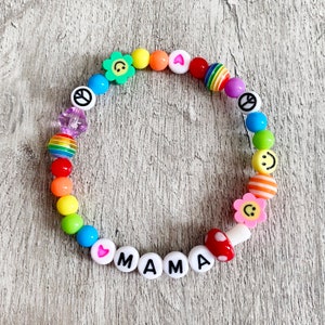 Mixed beaded festival bracelet. Rainbow beads, mushroom, hearts, smileys, flowers. Personalise with any name or word.