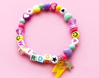 Pastel rainbow mixed bead bracelet. Can be personalised with any name or word. Lightning bolt and star charm. Smileys and hearts.