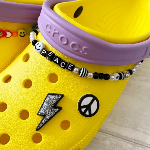 white crocs with yellow strap