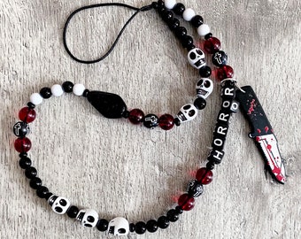 Halloween phone charm. Gothic. Horror. Black and White with blood red feature beads and skulls.