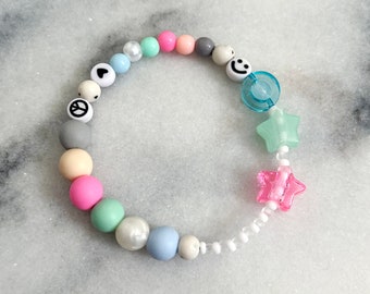 Fidget sensory bracelet for anxiety relief/ADHD Autism. Pastel colours with hearts, stars, smileys.