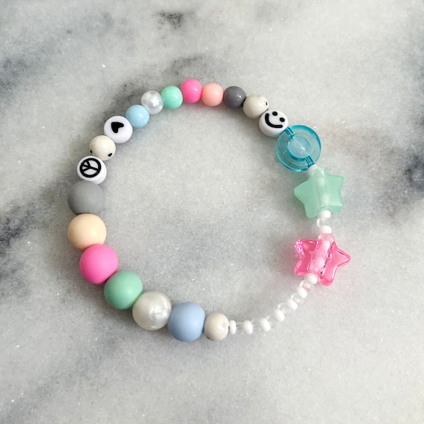 Pulsera sensorial Fidget para aliviar la ansiedad/autismo TDAH. Colores pastel con corazones, estrellas, emoticones.