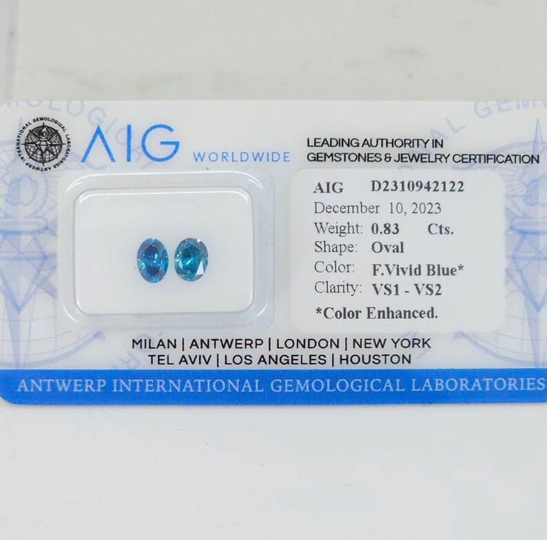 Natural Certified Vivid Blue Diamond Pair, AIG Certified .83ct Oval