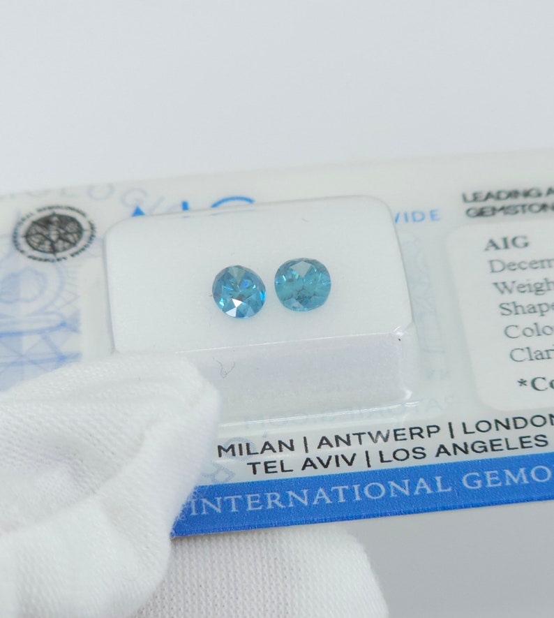 Natural Certified Vivid Blue Diamond Pair, AIG Certified .83ct Oval