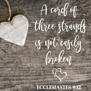 May include: A white wooden heart hangs on a rustic wooden background with the text "A cord of three strands is not easily broken" and "Ecclesiastes 4:12" below.