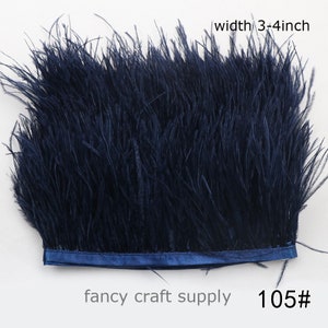 Puede incluir: Una cinta de plumas de avestruz azul oscuro con un ancho de 3-4 pulgadas. La cinta está hecha de plumas suaves y esponjosas y es perfecta para agregar un toque de elegancia a cualquier proyecto. 105#