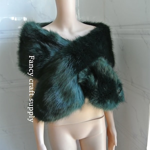 May include: A dark green faux fur shawl. The shawl is draped over a mannequin's shoulders. The text "Fancy craft supply" is visible on the left side of the image.