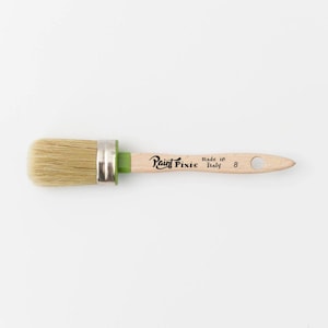 May include: A round paint brush with a green handle and a wooden shaft. The shaft is labeled "Paint Pixie" and "Made in Italy".