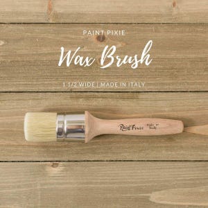 May include: A 1 1/2 inch wide natural bristle wax brush with a wooden handle and silver metal ferrule. The brush is made in Italy and is labeled "Paint Pixie".