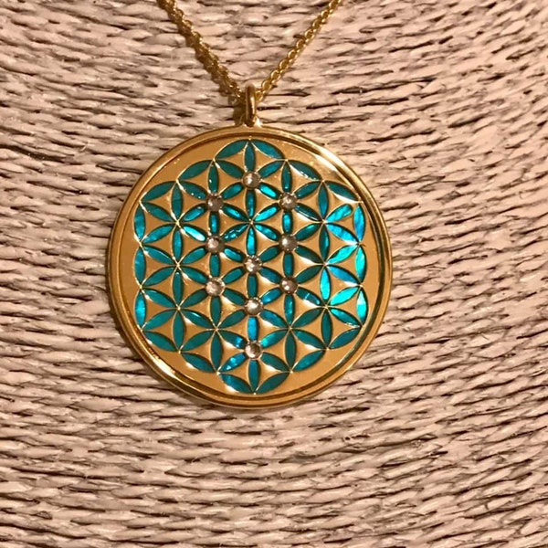 Flower of Life in 24 carat gold on 925 silver, acquamarine mother of pearl backdrop and crystal sephiroth.  Jewel with pendant and necklace