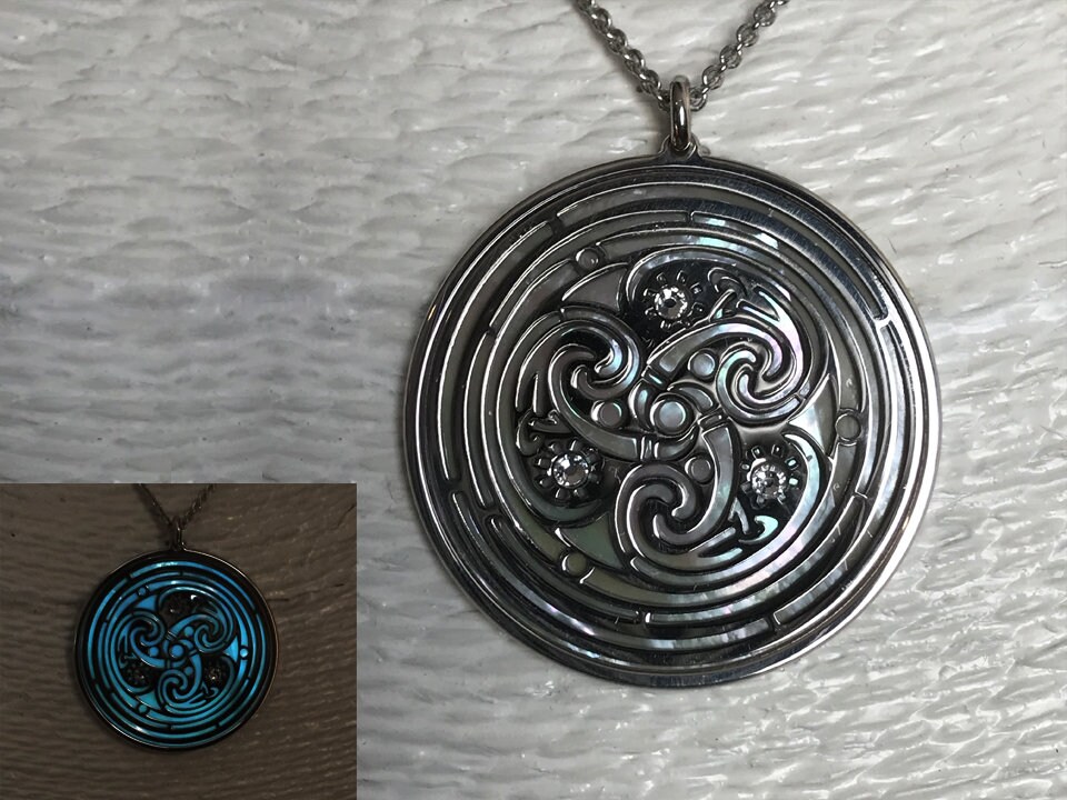 Triskele in rhodium on 925 silver with luminescent mother of pearl and crystals. Celtic gothic jewel, triple spiral spiritual necklace