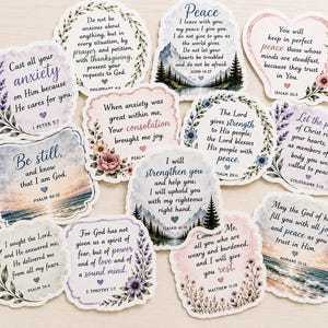 May include: A collection of twelve die-cut stickers featuring various Bible verses and inspirational quotes. Each sticker displays unique floral, mountain, or ocean illustrations in soft pastel colors, with text printed in black and purple script.