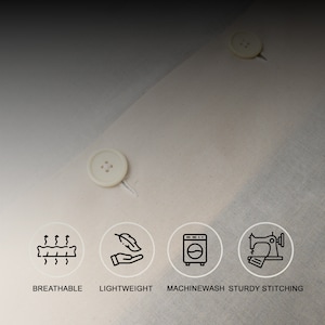 May include: Close-up of a beige fabric with four icons representing the features of the fabric: breathable, lightweight, machine washable, and sturdy stitching.