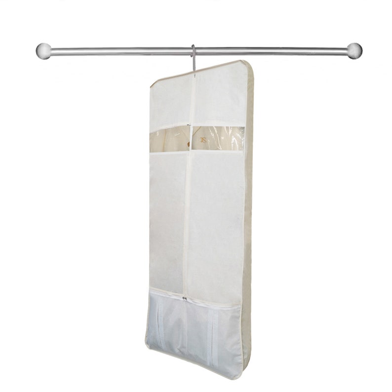 May include: A white garment bag with a clear plastic window and a zipper closure. The bag is hanging from a silver rod.