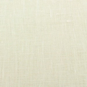 May include: A close-up of a plain, off-white fabric with a subtle woven texture.