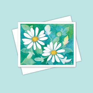 Carte de correspondance marguerite pour toutes les occasions : trois marguerites à l'aquarelle, vue de dessus