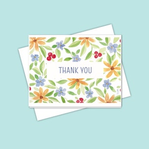 Carte de remerciement florale d'inspiration automnale avec des fleurs bleues et dorées