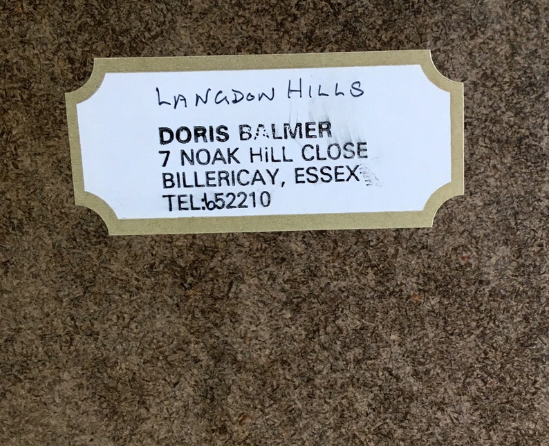 May include: A white label with black text that reads "LANGDON HILLS", "DORIS BALMER", "7 NOAK HILL CLOSE", "BILLERICAY, ESSEX", and "TEL: 652210".
