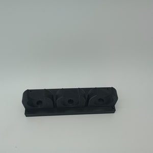Baseball bat holder, wall mount.