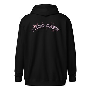 May include: Black hooded sweatshirt with a pink graphic that says "I BOO CREW" with a witch hat and stars.