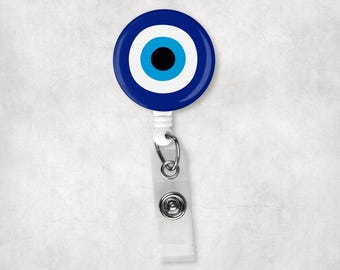 Badge Reel, Evil Eye. Design on a White Belt Clip Style Reel