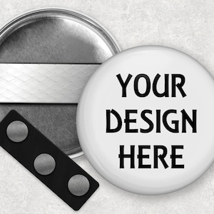 May include: A white button with a black border and the text "YOUR DESIGN HERE" in black.